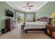 Relaxing main bedroom featuring a decorative ceiling fan, sliding glass doors and lots of light at 8445 Lone Eagle Way, Sarasota, FL 34241