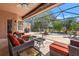 Inviting patio with comfortable seating, dining table, and lush greenery views at 8445 Lone Eagle Way, Sarasota, FL 34241