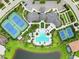 Aerial view of community center, pool, tennis courts, and lush landscaping at 8641 Rain Song Rd, Sarasota, FL 34238