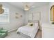 Bright bedroom with neutral tones, a single bed, and a decorative light fixture at 8641 Rain Song Rd, Sarasota, FL 34238