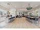 Spacious clubhouse with tables, chairs, and a kitchenette at 8641 Rain Song Rd, Sarasota, FL 34238