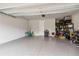 Spacious two-car garage with epoxy flooring, ample storage space, and convenient access to the home's interior at 8641 Rain Song Rd, Sarasota, FL 34238