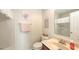 Well-lit bathroom featuring a charming vanity, decorative accents, and a shower-tub combination at 8907 White Sage Loop, Lakewood Ranch, FL 34202