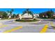 Beautiful community entrance with lush landscaping and a welcoming Willowbrook sign, enhancing curb appeal at 8907 White Sage Loop, Lakewood Ranch, FL 34202