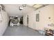 Spacious garage with ample storage, epoxy flooring, and room for multiple vehicles at 8907 White Sage Loop, Lakewood Ranch, FL 34202