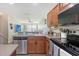 Close up of the kitchen with stainless steel appliances, ample counter space, open concept at 8907 White Sage Loop, Lakewood Ranch, FL 34202