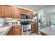 Close up of the kitchen with stainless steel appliances and ample counter space at 8907 White Sage Loop, Lakewood Ranch, FL 34202