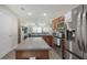 Bright kitchen showcases stainless steel appliances, a center island, and an open layout at 8907 White Sage Loop, Lakewood Ranch, FL 34202