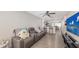 Comfortable living room with modern furnishings, open floor plan, and entertainment center at 8907 White Sage Loop, Lakewood Ranch, FL 34202