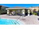 Community pool and clubhouse area with outdoor seating, perfect for relaxing or entertaining guests at 8907 White Sage Loop, Lakewood Ranch, FL 34202