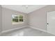 Bright bedroom featuring a large window with a view to the green outdoors at 920 Lena Ln, Sarasota, FL 34240