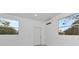 Bright bedroom with natural light, mini-split air conditioner, and neutral walls at 920 Lena Ln, Sarasota, FL 34240