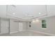 Spacious main bedroom with natural lighting, tile floors, and a barn door leading to closet space at 920 Lena Ln, Sarasota, FL 34240