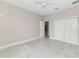 Spacious bedroom with a ceiling fan and double door closet at 920 Lena Ln, Sarasota, FL 34240