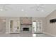 Cozy fireplace with a beautiful stone surround and mantle and views of the exterior at 920 Lena Ln, Sarasota, FL 34240