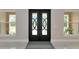 Elegant front door and entryway featuring an impressive doorway, flanked by sidelight windows at 920 Lena Ln, Sarasota, FL 34240