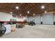 Wide open garage interior with tractor, utility vehicles, and ample storage space at 920 Lena Ln, Sarasota, FL 34240