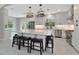 Spacious kitchen with a large island with seating, white cabinets, and stainless steel appliances at 920 Lena Ln, Sarasota, FL 34240
