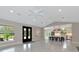 Open-concept living area with modern finishes including high ceilings and marble flooring at 920 Lena Ln, Sarasota, FL 34240