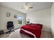 Cozy bedroom with a ceiling fan, desk, and window view at 9927 58Th E St, Parrish, FL 34219