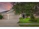 Charming home featuring a well-maintained lawn, an attached two-car garage and beautiful landscaping at 9927 58Th E St, Parrish, FL 34219