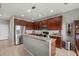 Bright kitchen featuring stainless steel appliances, ample countertop space, and dark cabinetry at 9927 58Th E St, Parrish, FL 34219