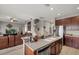 Spacious kitchen with stainless steel appliances, countertops, and an open view to the living area at 9927 58Th E St, Parrish, FL 34219