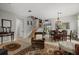 Open living area with stairs, multiple seating options and connected to a dining area at 9927 58Th E St, Parrish, FL 34219