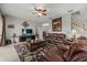 Inviting living room featuring comfortable leather seating, a decorative rug, and an entertainment center at 9927 58Th E St, Parrish, FL 34219