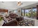 Comfortable living room with leather seating and sliding glass doors to the outdoor area at 9927 58Th E St, Parrish, FL 34219