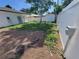 Backyard with newly laid dirt and grass features a white privacy fence at 1019 34Th W Ave, Bradenton, FL 34205