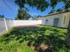 Backyard with newly laid dirt and grass features a white privacy fence at 1019 34Th W Ave, Bradenton, FL 34205