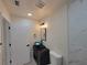 A stylish bathroom features a dark vanity with a modern bowl sink, and black light fixtures at 1019 34Th W Ave, Bradenton, FL 34205