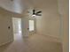 An airy, tiled bedroom featuring a ceiling fan, window, and access to an outdoor patio at 1019 34Th W Ave, Bradenton, FL 34205