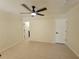 Bedroom featuring a ceiling fan, neutral color scheme, and access to ensuite at 1019 34Th W Ave, Bradenton, FL 34205