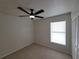 Neutral bedroom includes a ceiling fan, window, and closet at 1019 34Th W Ave, Bradenton, FL 34205