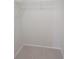 A walk-in closet with tile floor and wire rack at 1019 34Th W Ave, Bradenton, FL 34205
