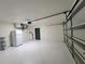 A well-lit two-car garage featuring modern overhead door and plenty of space for vehicle parking and storage at 1019 34Th W Ave, Bradenton, FL 34205