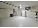 Clean, spacious garage includes a refrigerator, water heater, and ladders, perfect for storage and projects at 1019 34Th W Ave, Bradenton, FL 34205