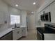 Bright kitchen featuring stainless steel appliances, white cabinetry, and quartz countertops at 1019 34Th W Ave, Bradenton, FL 34205