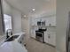 Modern kitchen featuring stainless steel appliances, white cabinets, and quartz countertops at 1019 34Th W Ave, Bradenton, FL 34205