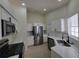 Modern kitchen with stainless steel appliances, white cabinets, and quartz countertops at 1019 34Th W Ave, Bradenton, FL 34205