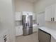 Bright kitchen featuring stainless steel appliances, white cabinetry, and quartz countertops at 1019 34Th W Ave, Bradenton, FL 34205