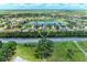 Aerial view of community near pond at 12851 24Th Street E Cir, Parrish, FL 34219