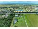 Aerial view of the community near pond and golf course at 12851 24Th Street E Cir, Parrish, FL 34219