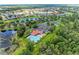 Community with bright swimming pool, tennis courts and lake views, surrounded by lush landscaping at 12851 24Th Street E Cir, Parrish, FL 34219