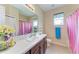 Bathroom featuring a bright countertop, decorative flower and bright towels at 12851 24Th Street E Cir, Parrish, FL 34219