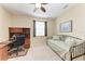 Bedroom featuring a desk area, daybed, and neutral decor for flexible space at 12851 24Th Street E Cir, Parrish, FL 34219