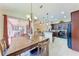 Open dining and kitchen area with view to the patio at 12851 24Th Street E Cir, Parrish, FL 34219