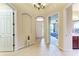 Bright foyer features neutral walls and tile flooring, leading to the living areas at 12851 24Th Street E Cir, Parrish, FL 34219